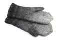 Wool gray knitted mittens on a white