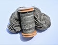 Wool handspun yarn skein and bobbin filled with handspun yarn. Spinning. Yarn. Ply. Royalty Free Stock Photo