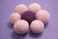 Woolen beads on a violet background