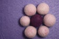 Woolen beads on a violet background