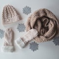 Woolen light blue scarf, gloves and hat over white Royalty Free Stock Photo