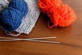 Woolen thread, knitting, knitting needles on wooden table Royalty Free Stock Photo