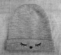 A woolen warm gray winter hat. Royalty Free Stock Photo