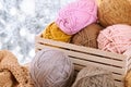 Woolen yarn and fabric on the window sill. Beautiful view outside the window - winter scenery and snow