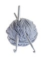 Woollen ball with knitting needle