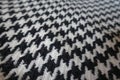 Woollen fabric with crow`s feet pattern in black and white