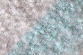 Woollen fluffy boucle scarf, macro. Soft pastel colors merino wool backdrop, closeup. Autumn and winter flat lay. Scandinavian