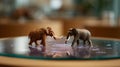 Woolly mammoth and elephant models showcase differences between extinct and living species Royalty Free Stock Photo