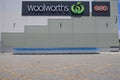 Woolworth Supermarket sign on building exterior wall