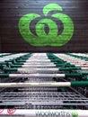 Woolworths Supermarkets logo sign with shopping trolleys