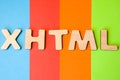 Word or abbreviation XHTML, meaning Extensible HyperText Markup Language as internet programming language is on background of four