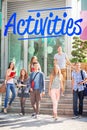 Activities against happy students walking and smliling outside Royalty Free Stock Photo