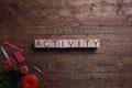 Word activity wooden cubes, blocks on the subject of education, development and training on a wooden background. Top view. Place