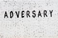 Word adversary painted on white brick wall Royalty Free Stock Photo