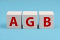 The word AGB is standing on wooden cubes, german language