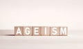 The word ageism on wooden blocks against white background. Age discrimination in business Royalty Free Stock Photo