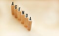 Word AGENDA. Wooden cubes with letters isolated on a light background Royalty Free Stock Photo