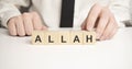 Word ALLAH made with wood building blocks