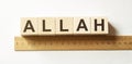 Word ALLAH made with wood building blocks