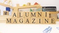 The word Alumnus magazine was created from wooden cubes. close up