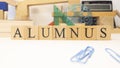 The word Alumnus was created from wooden cubes.