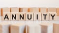 Word ANNUITY written on wood blocks, concept