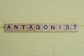 the word antagonist of gray small wooden letters