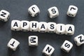 Word aphasia on toy cubes Royalty Free Stock Photo