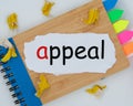 The word appeal is written on a torn piece of paper on a notepad. the concept of business, marketing