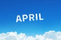 Word April made of clouds steam on blue sky background. Month planning, timetable concept.