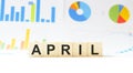 Word April made with wood building blocks