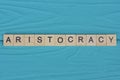 word aristocracy made from wooden gray letters