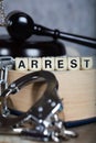 Word ARREST composed of wooden letters. Royalty Free Stock Photo