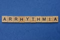 Word arrhythmia made from brown wooden letters