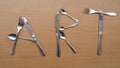 Word Art with metal forks spoons and knifes