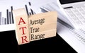 Word ATR made with wood building blocks, business concept