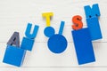 Word Autism built of colorful wooden blocks on wooden background Royalty Free Stock Photo