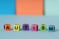 Word Autism made of colorful cubes on color background Royalty Free Stock Photo