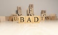 The word bad is from wooden cubes. Background from wooden letters Royalty Free Stock Photo