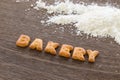 Word BAKERY Alphabet Biscuits on wood table Royalty Free Stock Photo