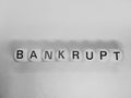 Word bankrupt spelled using dice