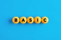 The word basic written on yellow balls