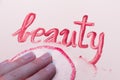 Word `beauty` written in lip gloss Royalty Free Stock Photo