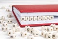 Word Behavior written in wooden blocks in notebook on white wood Royalty Free Stock Photo