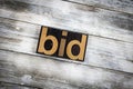 Bid Letterpress Word on Wooden Background Royalty Free Stock Photo