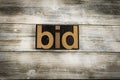 Bid Letterpress Word on Wooden Background Royalty Free Stock Photo