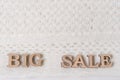 Word BIG SALE abstract wooden letters, background textured winter knitted woolen