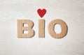 Word `Bio` made of cardboard letters and heart on light background Royalty Free Stock Photo