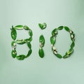 Word Bio made of leaves on green background. Top view. Flat lay. Ecology, eco friendly planet and sustainable environment concept Royalty Free Stock Photo