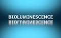 Word Bioluminescence on blue background
